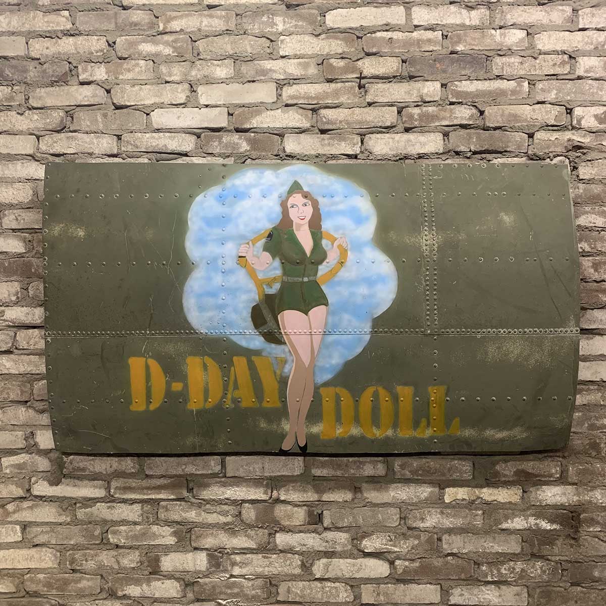 Original C-47 Dakota skin panel painted with D-Day Doll nose art for sale.