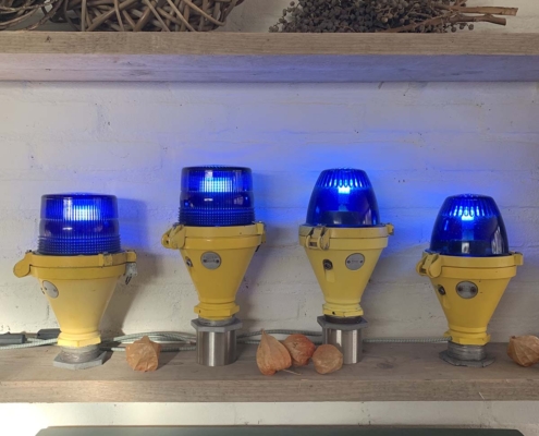 Four refurbished Thorn taxiway lights positioned next to each other to show all versions avialable for sale.